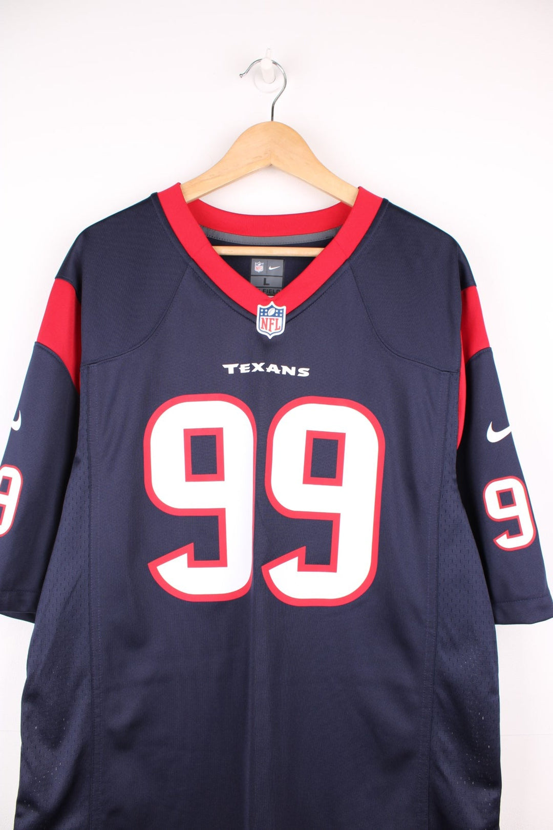 Houston Texans, Watt #99, Nike NFL jersey in a blue, red and white colourway. Features printed 99 on the front and back.