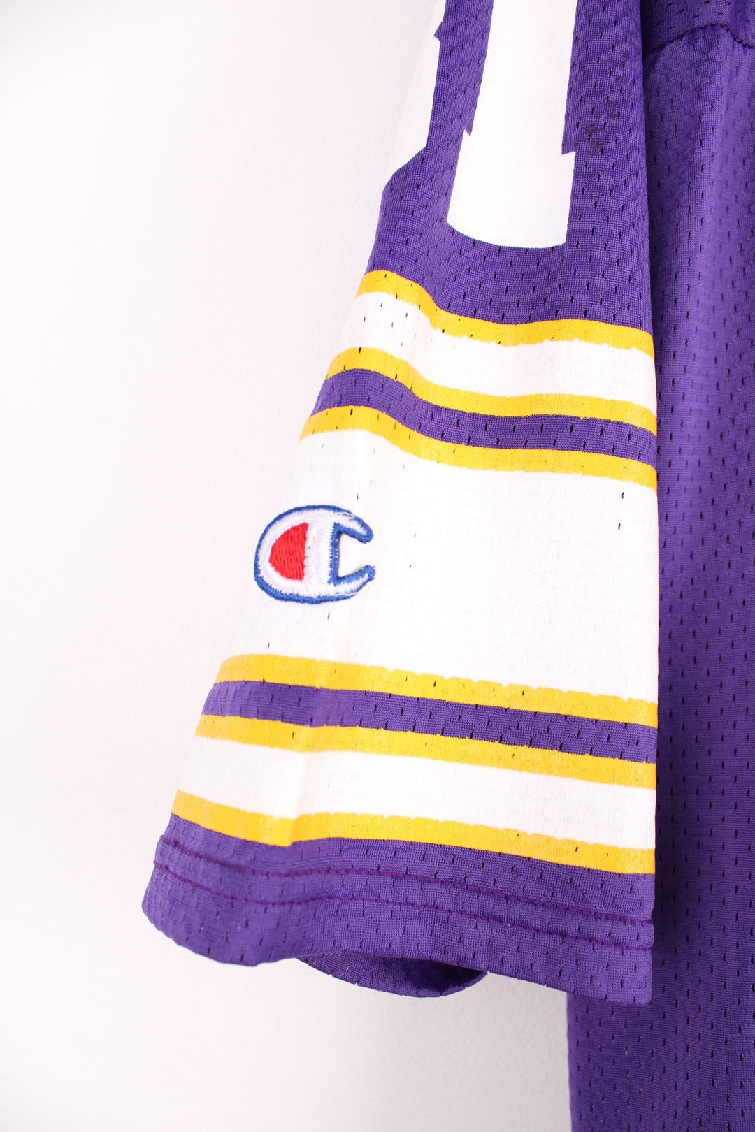  Champion Minnesota Vikings NFL jersey in purple with yellow and white accent stripes, an embroidered logo on the sleeve, and no.81 on the front, back and each sleeve.