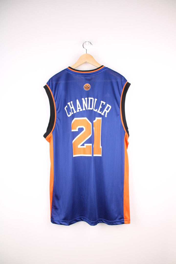 Adidas New York Knicks NBA jersey in blue with black and orange accents, multiple embroidered logos, and printed no.21 Chandler on the front and back.