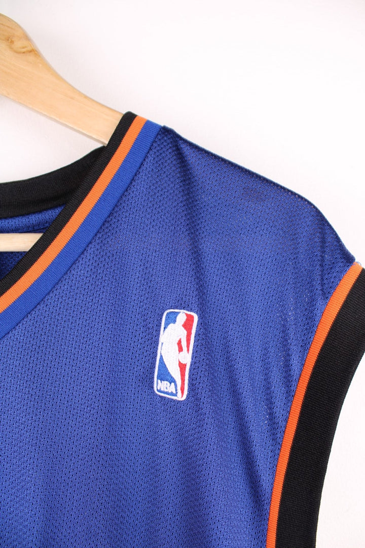 Adidas New York Knicks NBA jersey in blue with black and orange accents, multiple embroidered logos, and printed no.21 Chandler on the front and back.