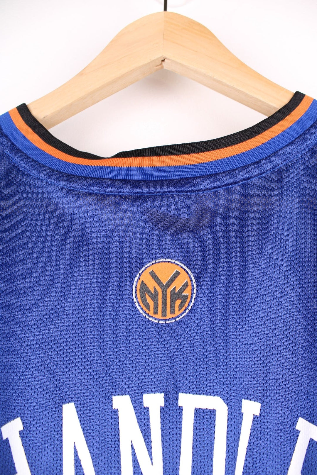 Adidas New York Knicks NBA jersey in blue with black and orange accents, multiple embroidered logos, and printed no.21 Chandler on the front and back.