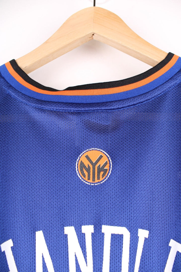 Adidas New York Knicks NBA jersey in blue with black and orange accents, multiple embroidered logos, and printed no.21 Chandler on the front and back.