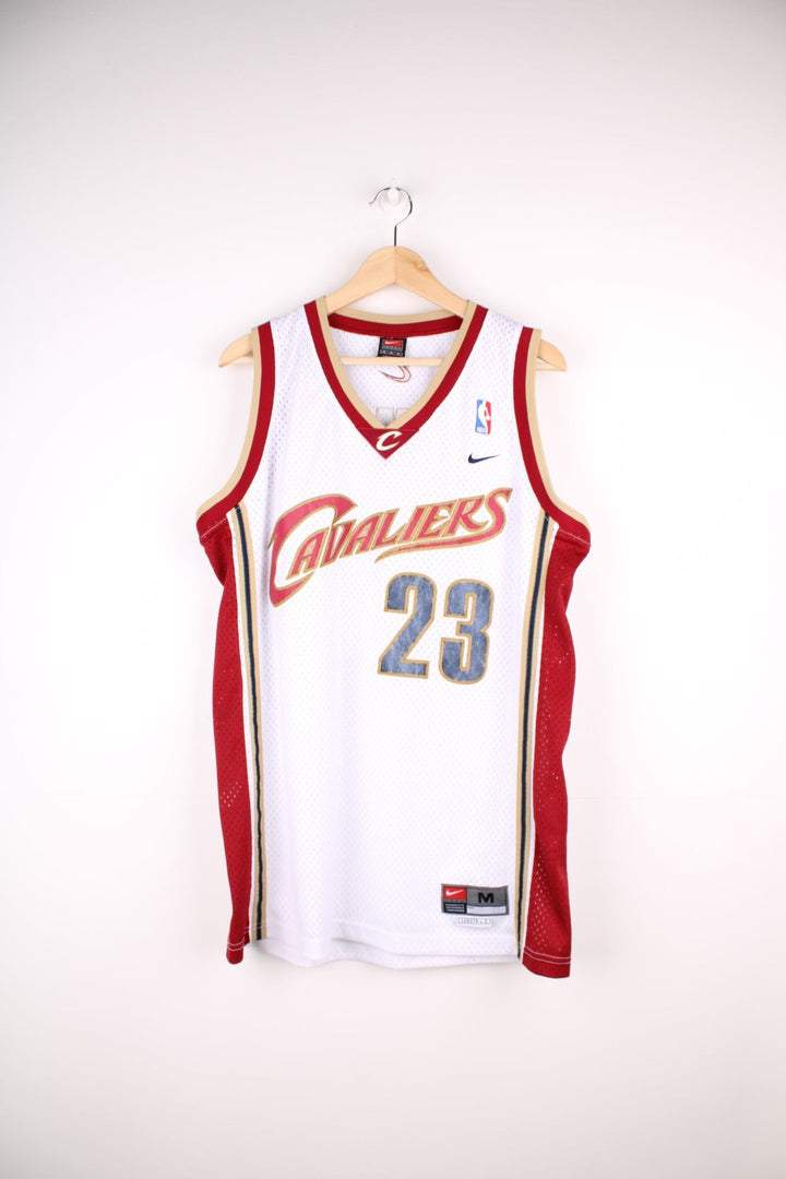 Cleveland Cavaliers NBA jersey in white with red and gold accents, multiple embroidered logos, no.23 Lebron James on the front and back.