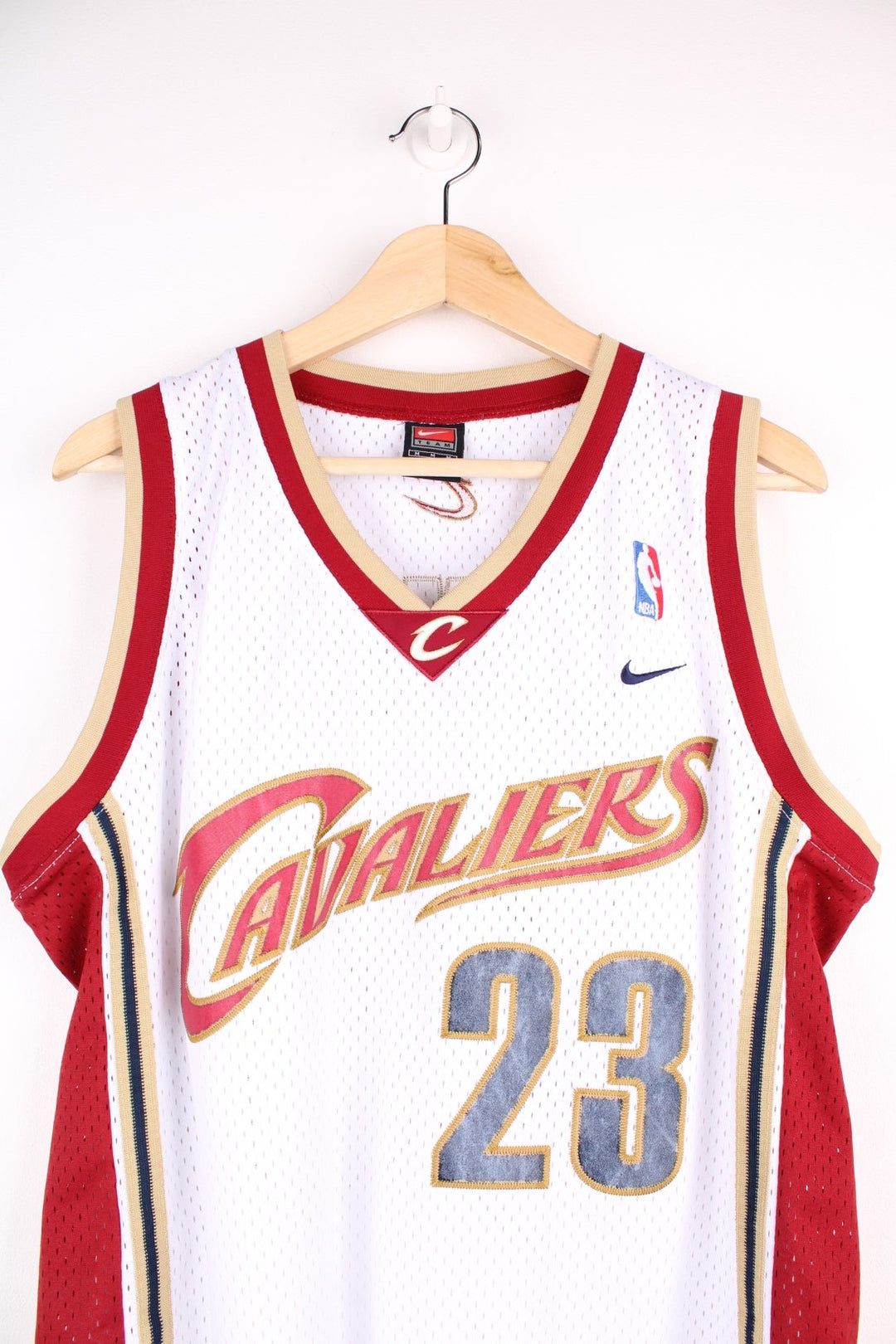 Cleveland Cavaliers NBA jersey in white with red and gold accents, multiple embroidered logos, no.23 Lebron James on the front and back.