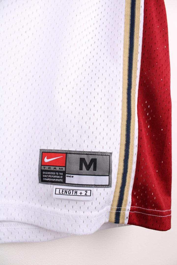 Cleveland Cavaliers NBA jersey in white with red and gold accents, multiple embroidered logos, no.23 Lebron James on the front and back.