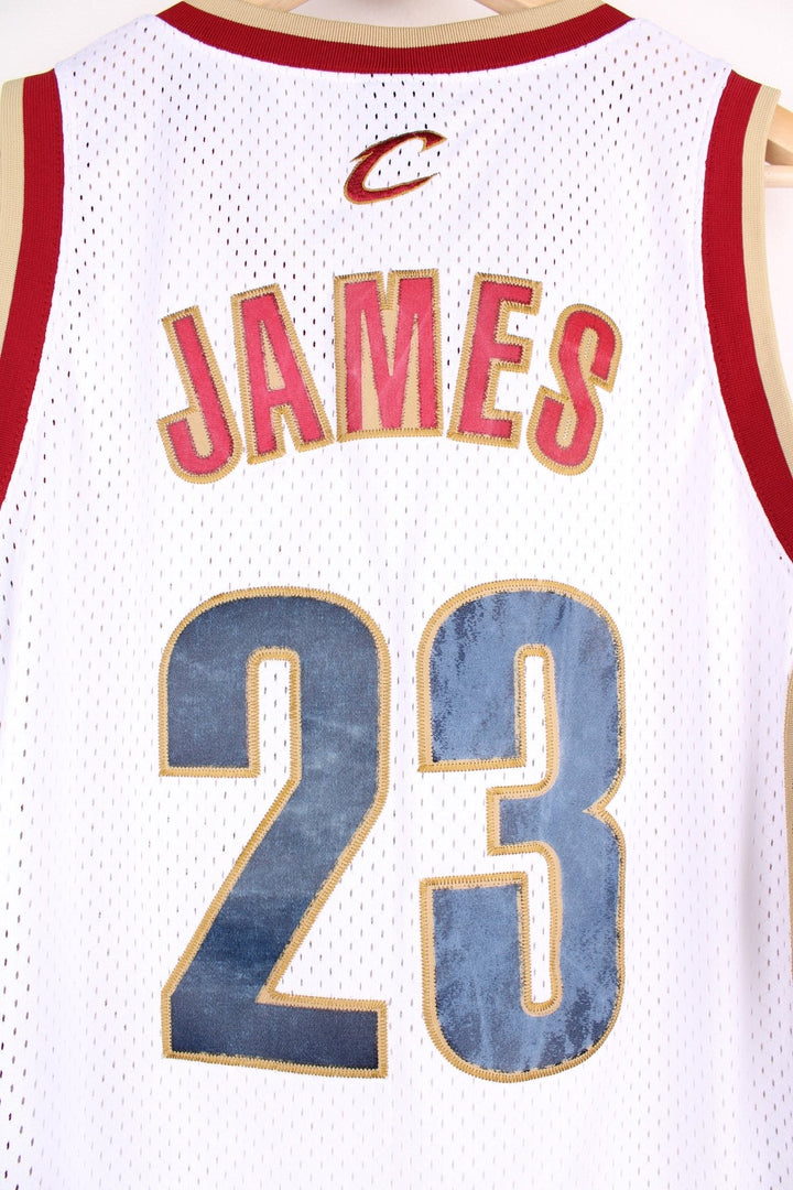 Cleveland Cavaliers NBA jersey in white with red and gold accents, multiple embroidered logos, no.23 Lebron James on the front and back.