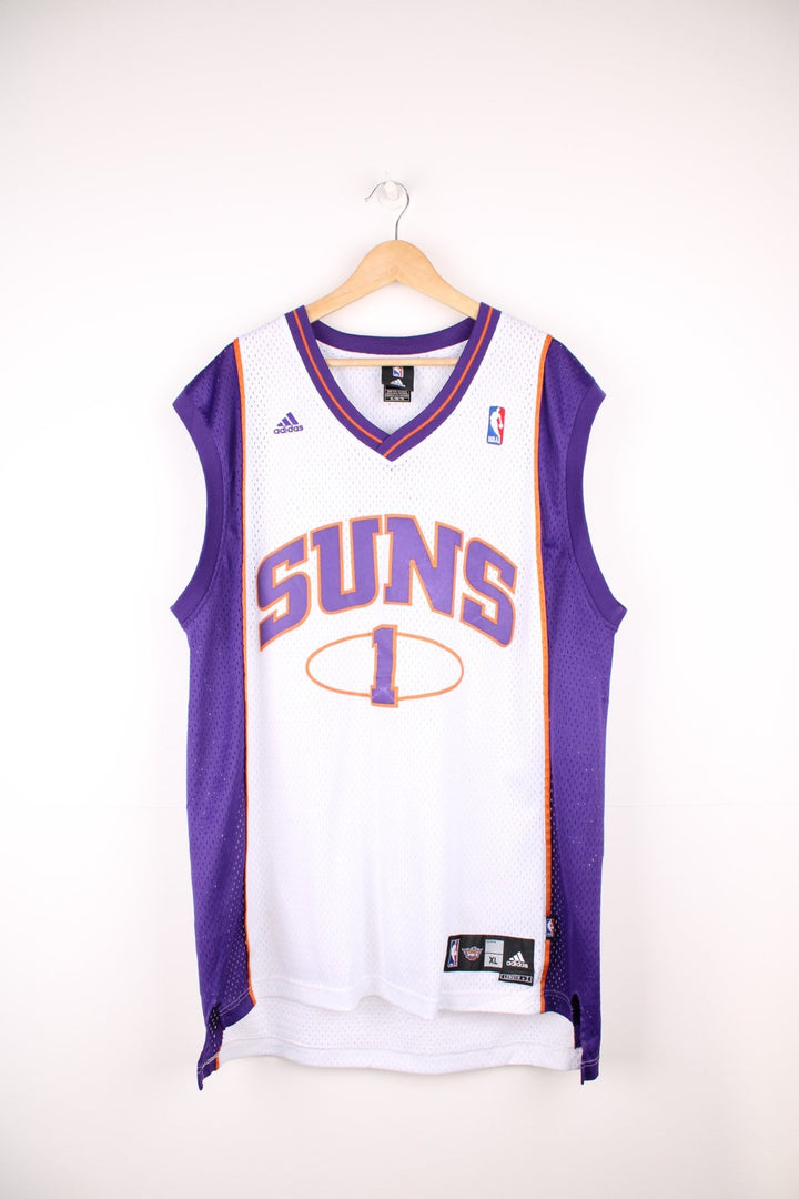 Phoenix Suns Amar'e Stoudemire #1 Adidas NBA jersey in a white, purple and orange colourway. Features embroidered lettering and logos on the chest.