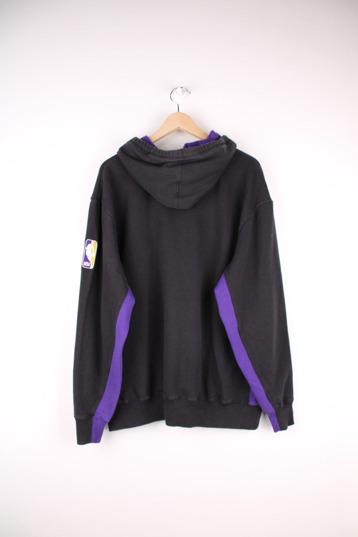 Los Angeles Lakers NBA Hoodie in a black and purple colourway with the spell out logo embroidered on the front. 