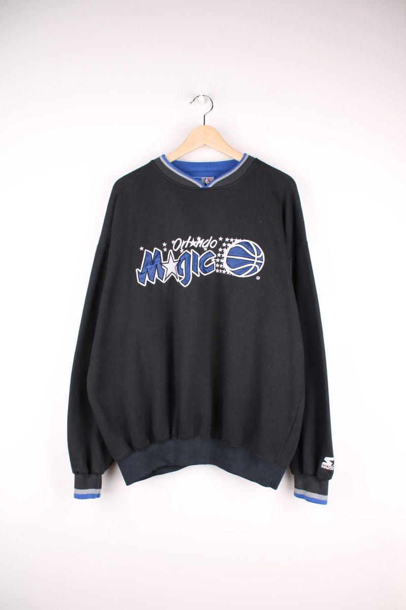 Orlando Magic NBA Sweatshirt in a black colourway with a v neck collar and the spell out logo embroidered across the front.