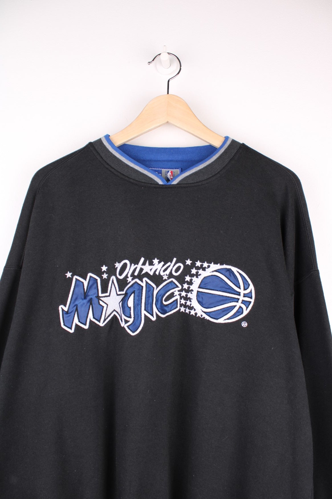 Orlando Magic NBA Sweatshirt in a black colourway with a v neck collar and the spell out logo embroidered across the front.