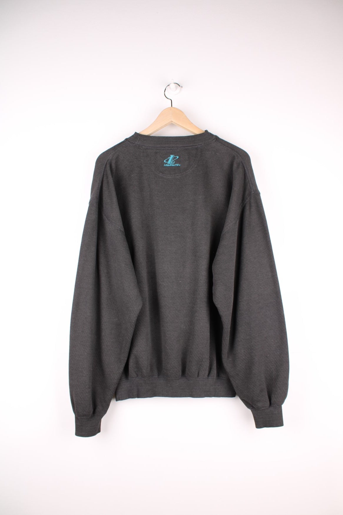 Vintage Jacksonville Jaguars Pro Line Sweatshirt in a faded black colourway with the spell out logo embroidered across the front. 