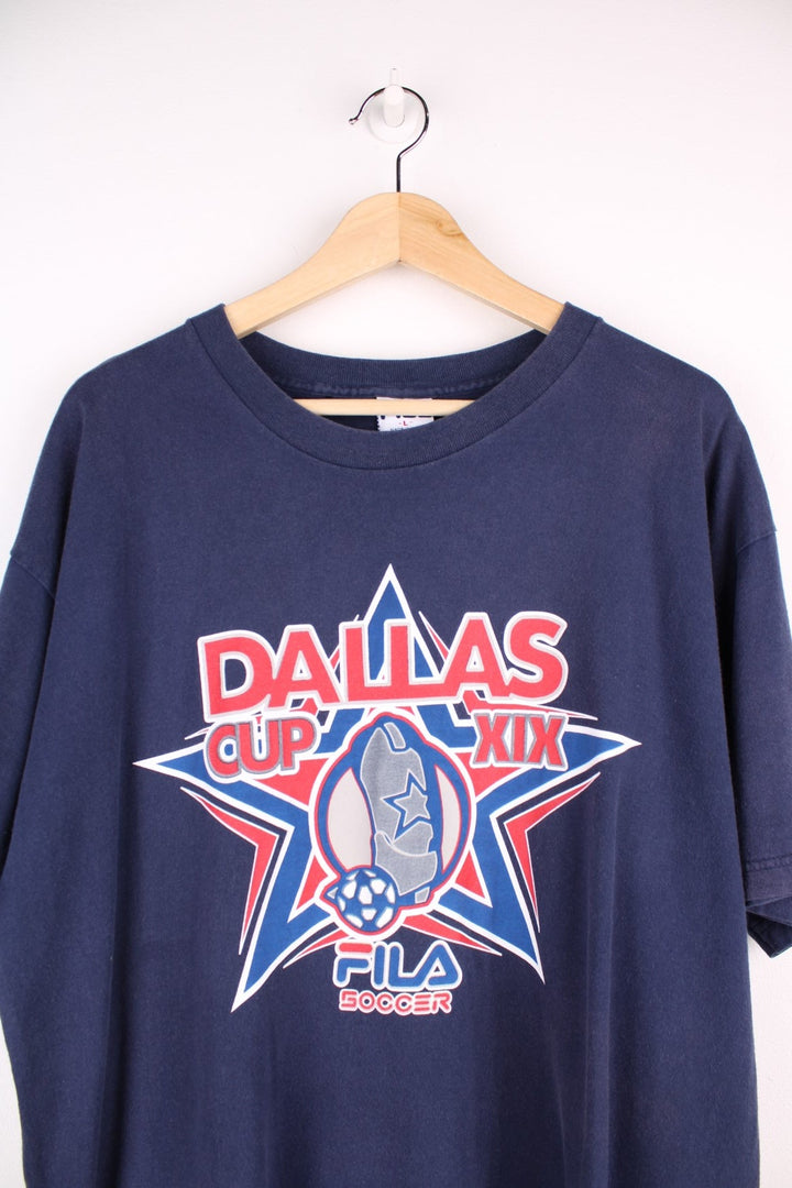 Fila FC Dallas soccer t-shirt in navy blue with front star logo graphic, spellout reading 'Dallas Cup XIX', and Fila Sport logos on the front, back and sleeve.