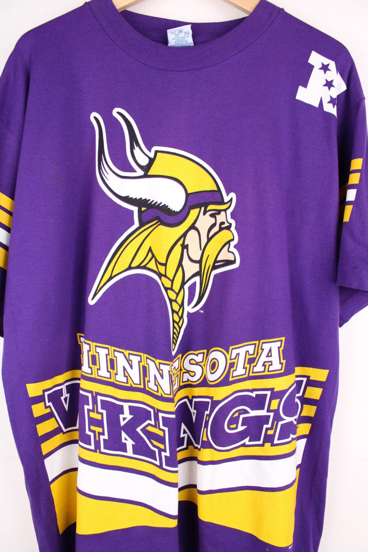 Minnesota Vikings NHL T-Shirt in purple with yellow stripe detailing, a viking graphic and team name spellout on the front, and large V design on the back..