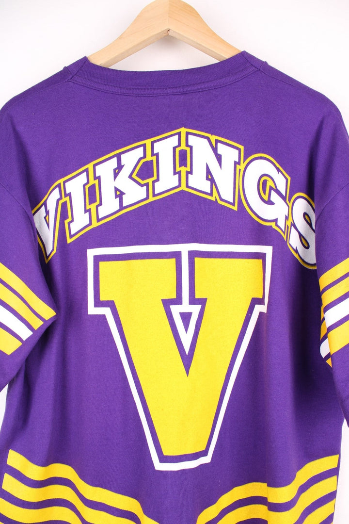 Minnesota Vikings NHL T-Shirt in purple with yellow stripe detailing, a viking graphic and team name spellout on the front, and large V design on the back..