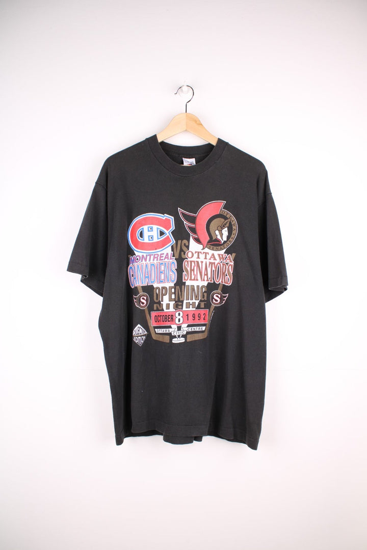 1992 Montreal Canadiens vs Ottawa SenatorsNHL T-Shirt in black with team logo crests on the front, and coloseum graphic on the back with spellout reading 'Dawn of a New Empire' Signed on the back.