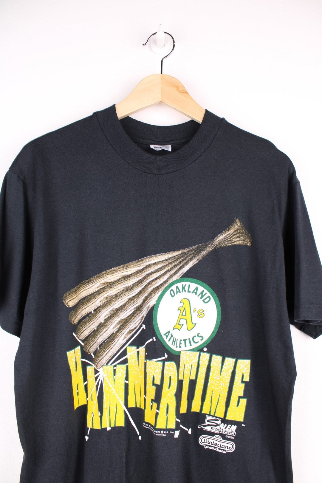 Oakland Athletics MLB t-shirt in black with baseball bat graohic and spellout reading 'Hammer Time' and 'U Can't Touch This' in green and yellow on the front and back.