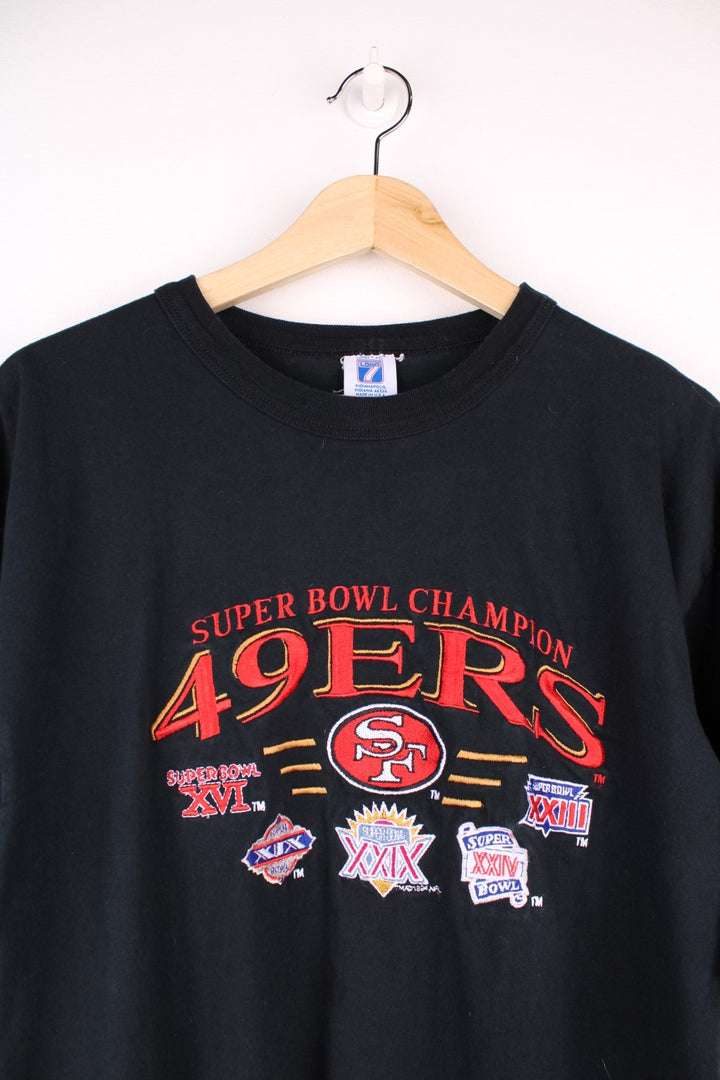 San Francisco 49ers NFL tee in red with 'Super Bowl Champions' spellout in red and a small Logo 7 patch on the sleeve.