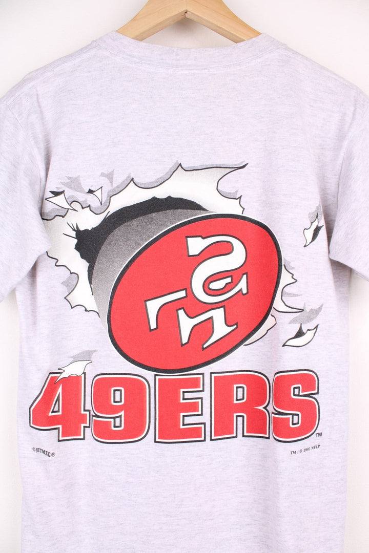 San Francisco 49ers NFL t-shirt in grey with front and back graphic of team logo bursting through the t-shirt.