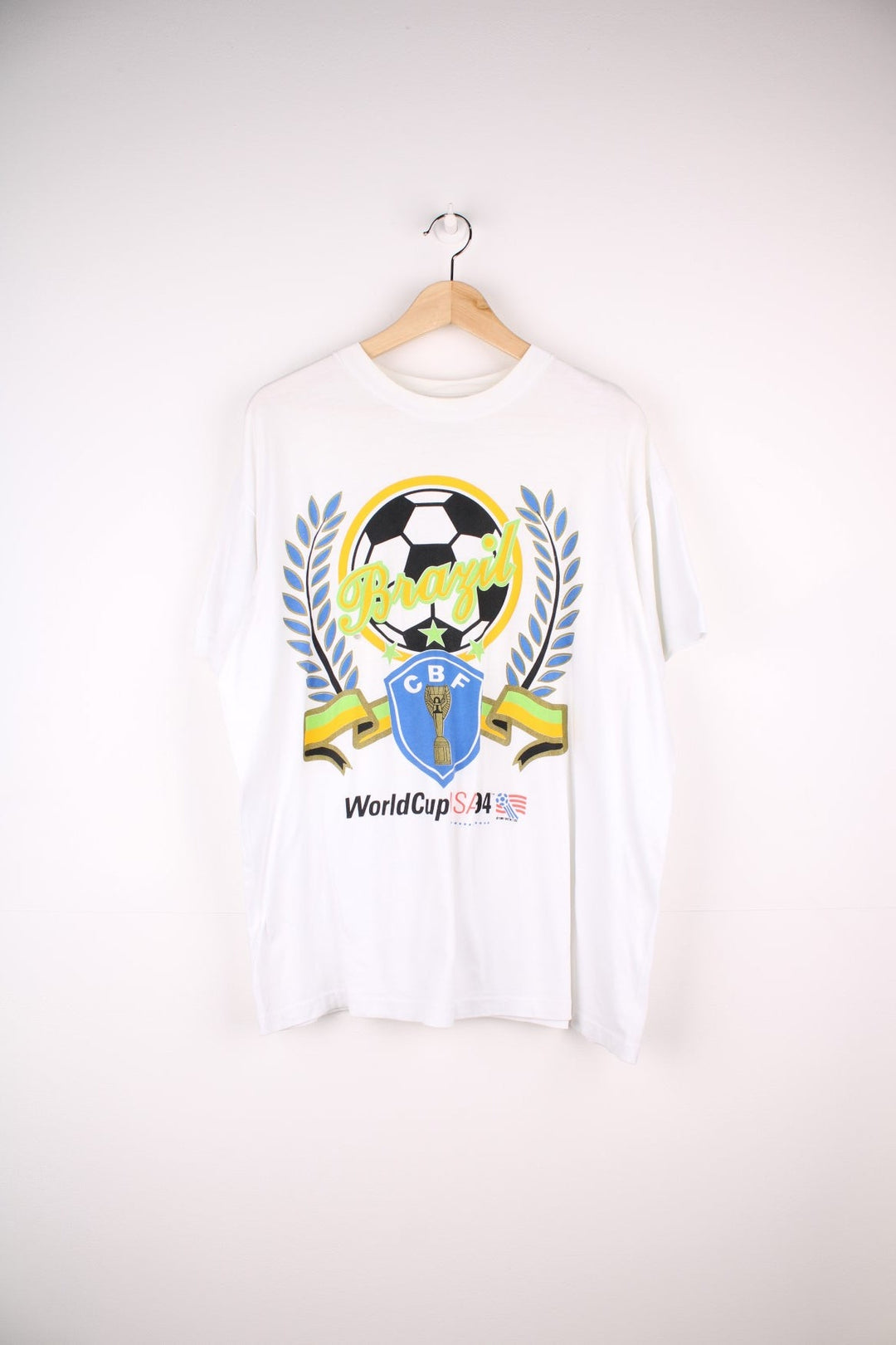 Vintage 1994 World Cup USA winners Brazil spellout t-shirt in white with football graphic and CBF crest design.