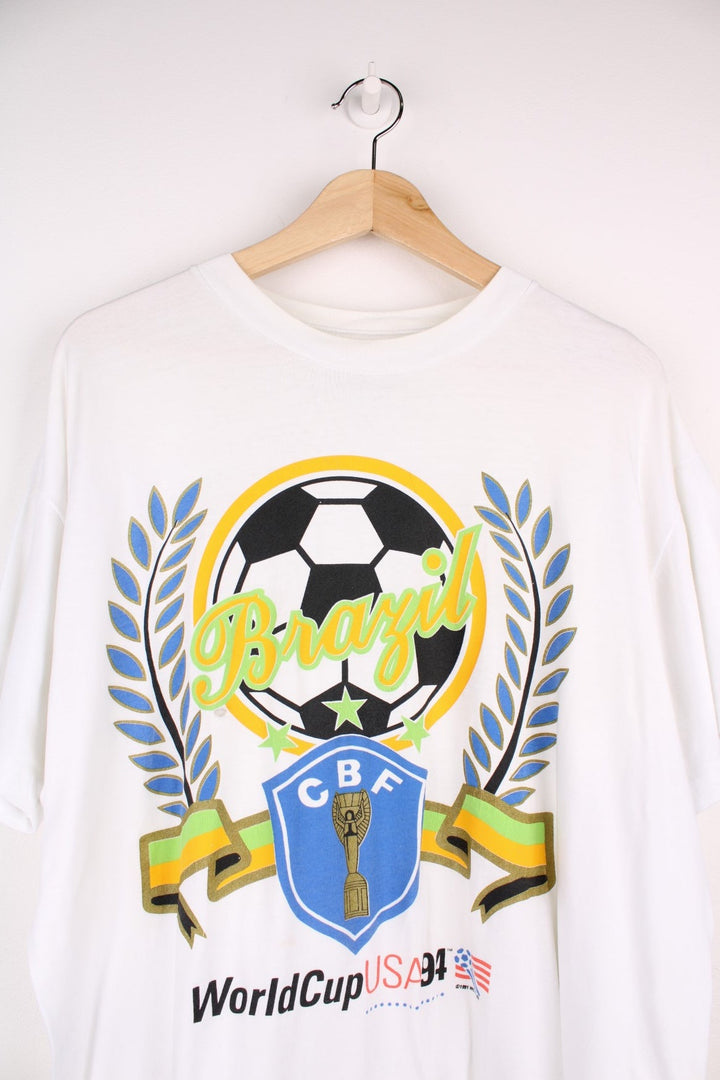 Vintage 1994 World Cup USA winners Brazil spellout t-shirt in white with football graphic and CBF crest design.