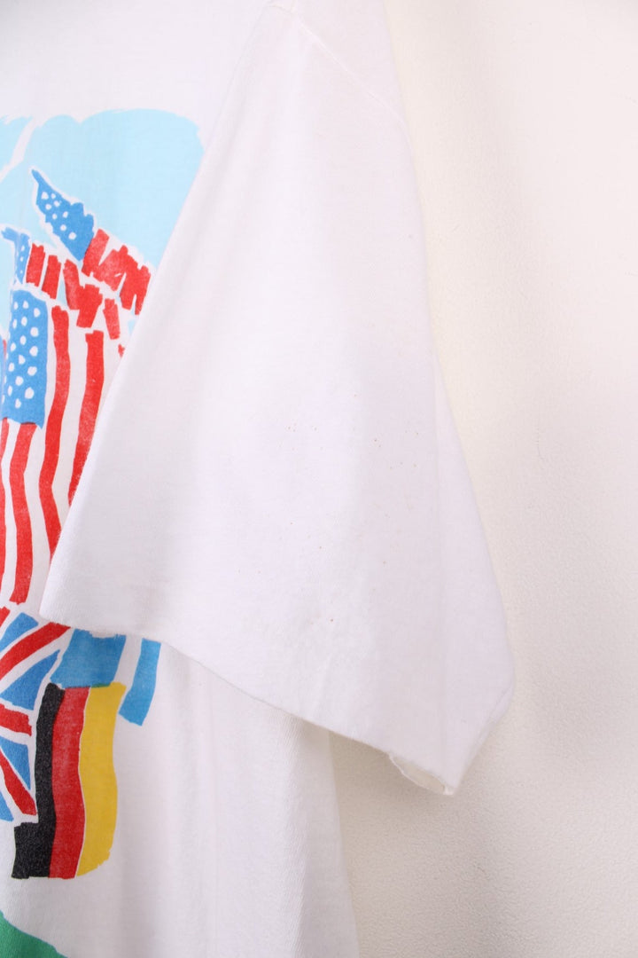 Vintage official 1991 US Open tee in white with colourful flags graphic on the front.