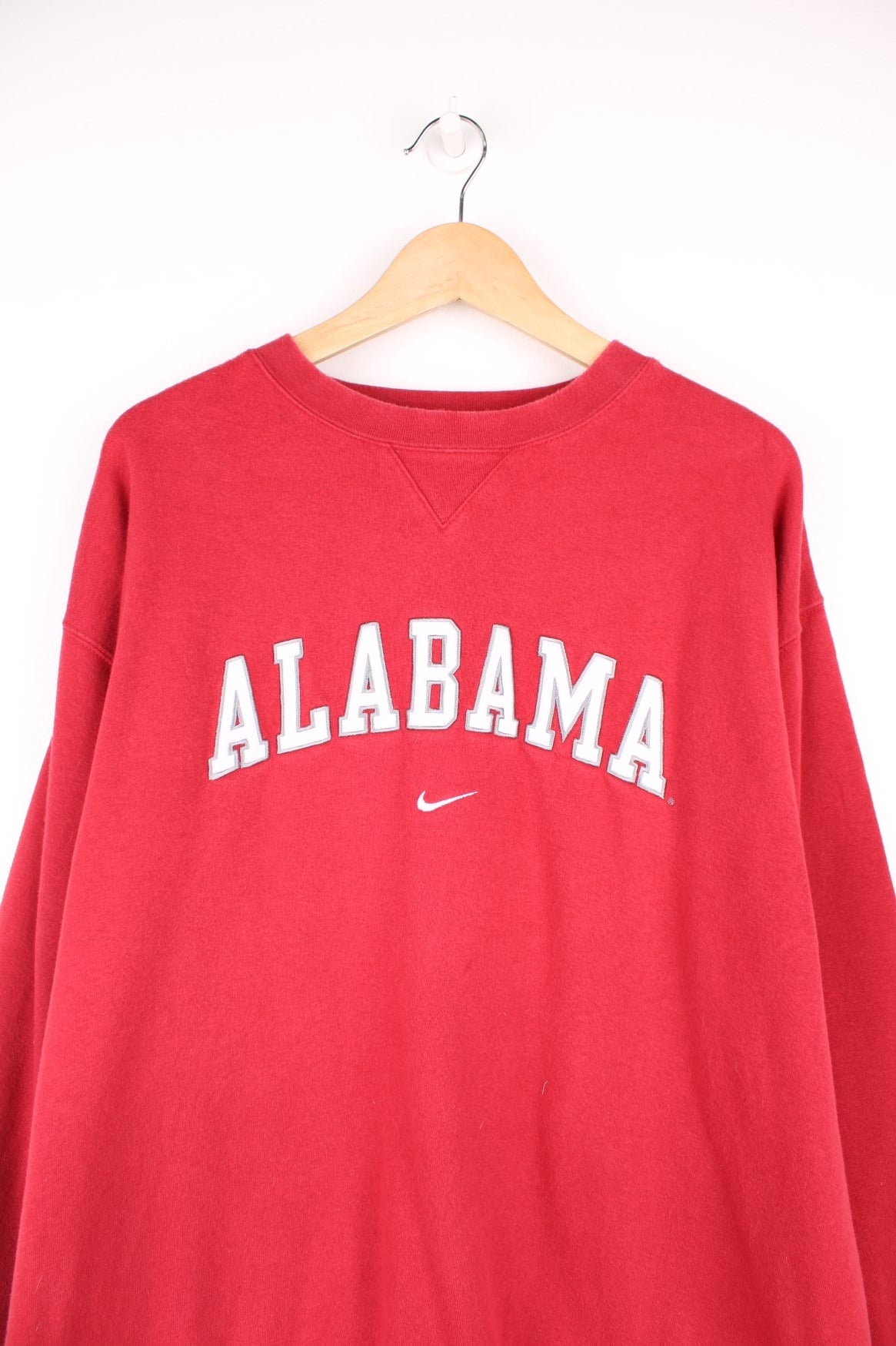 University Of Alabama Crimson Tide Football Team Nike Sweatshirt in a red and white colourway with the spell out logo embroidered across the front. 