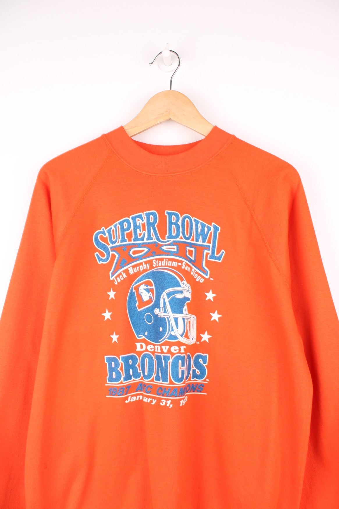 1988 Denver Broncos Super Bowl Champions Sweatshirt in a orange, blue and white colourway with the logo and spell out printed on the front. 