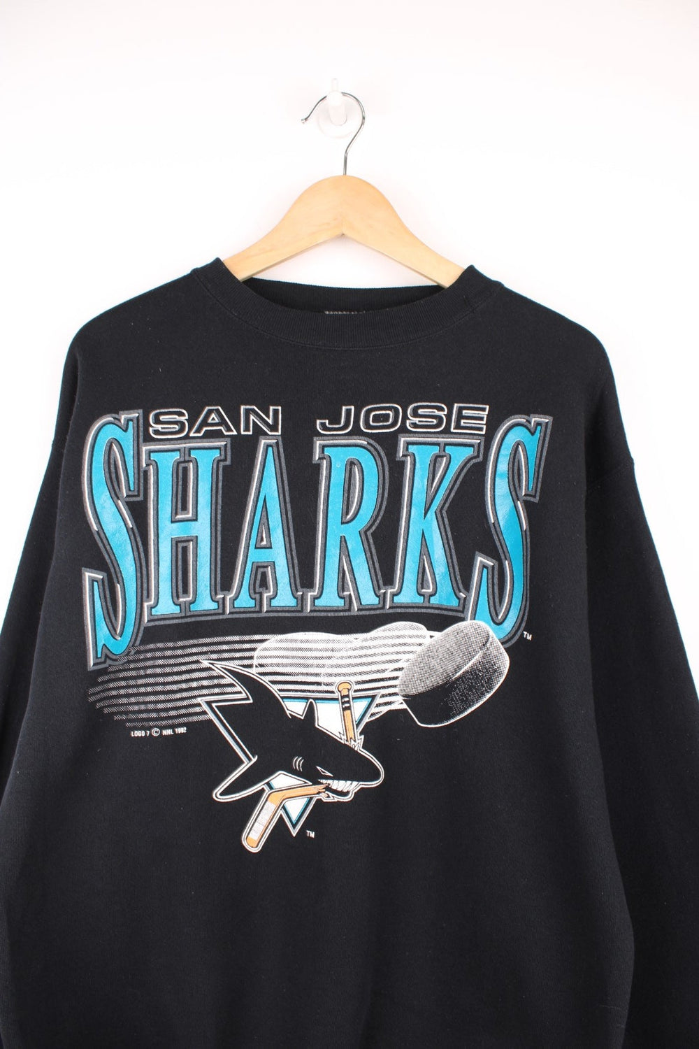 1992 San Jose Sharks Sweatshirt in a black, blue and white colourway with the spell out and team logo printed across the front. 