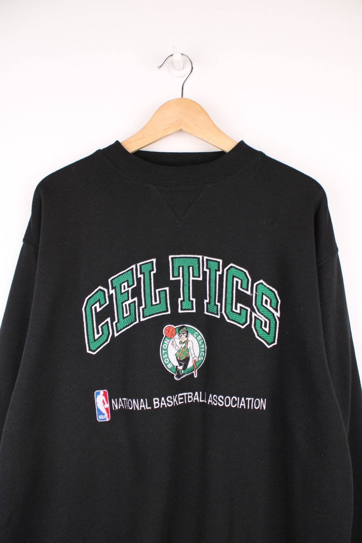 Boston Celtics NBA Sweatshirt in a black colourway with the logos and spell out embroidered on the front. 