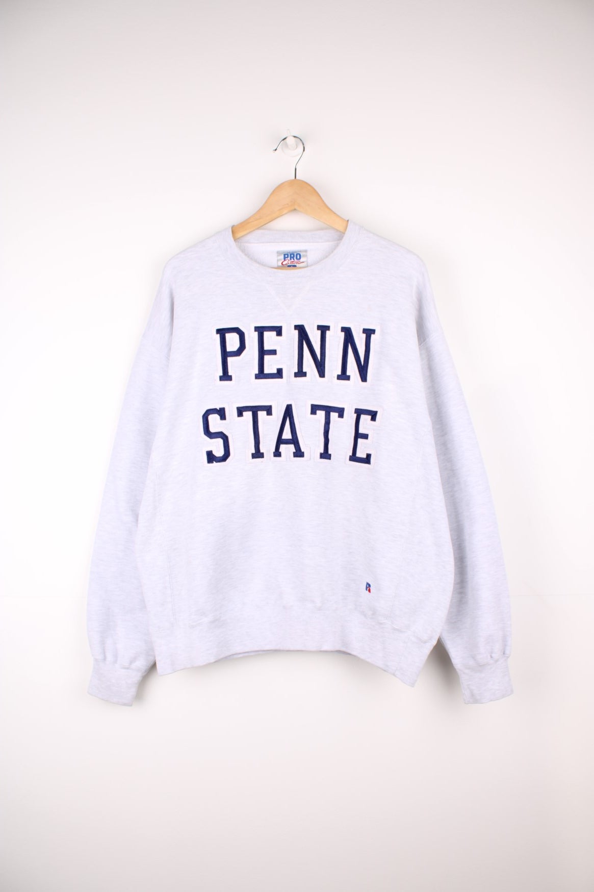 Russell Athletic Penn State Sweatshirt in a grey colourway with the spell out embroidered on the front.