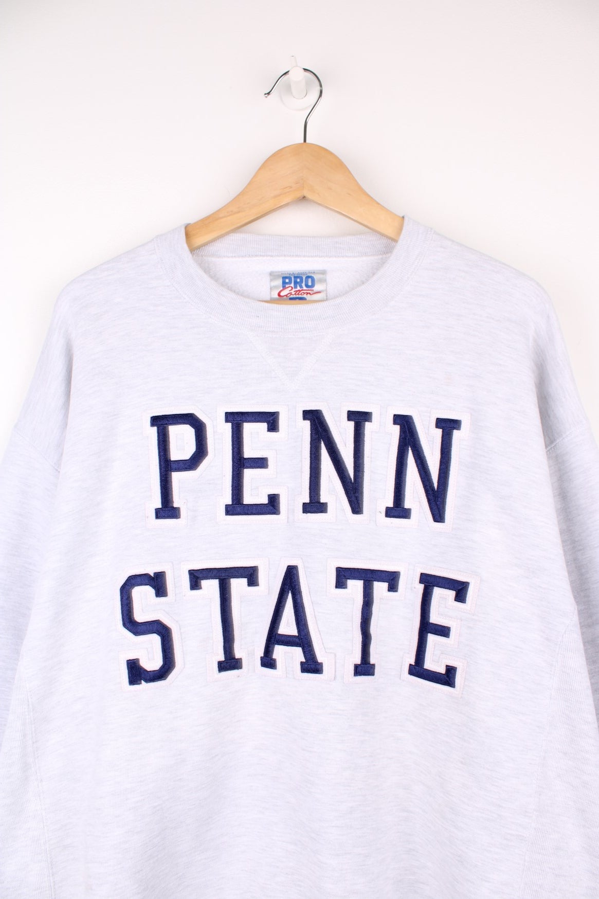 Russell Athletic Penn State Sweatshirt in a grey colourway with the spell out embroidered on the front.