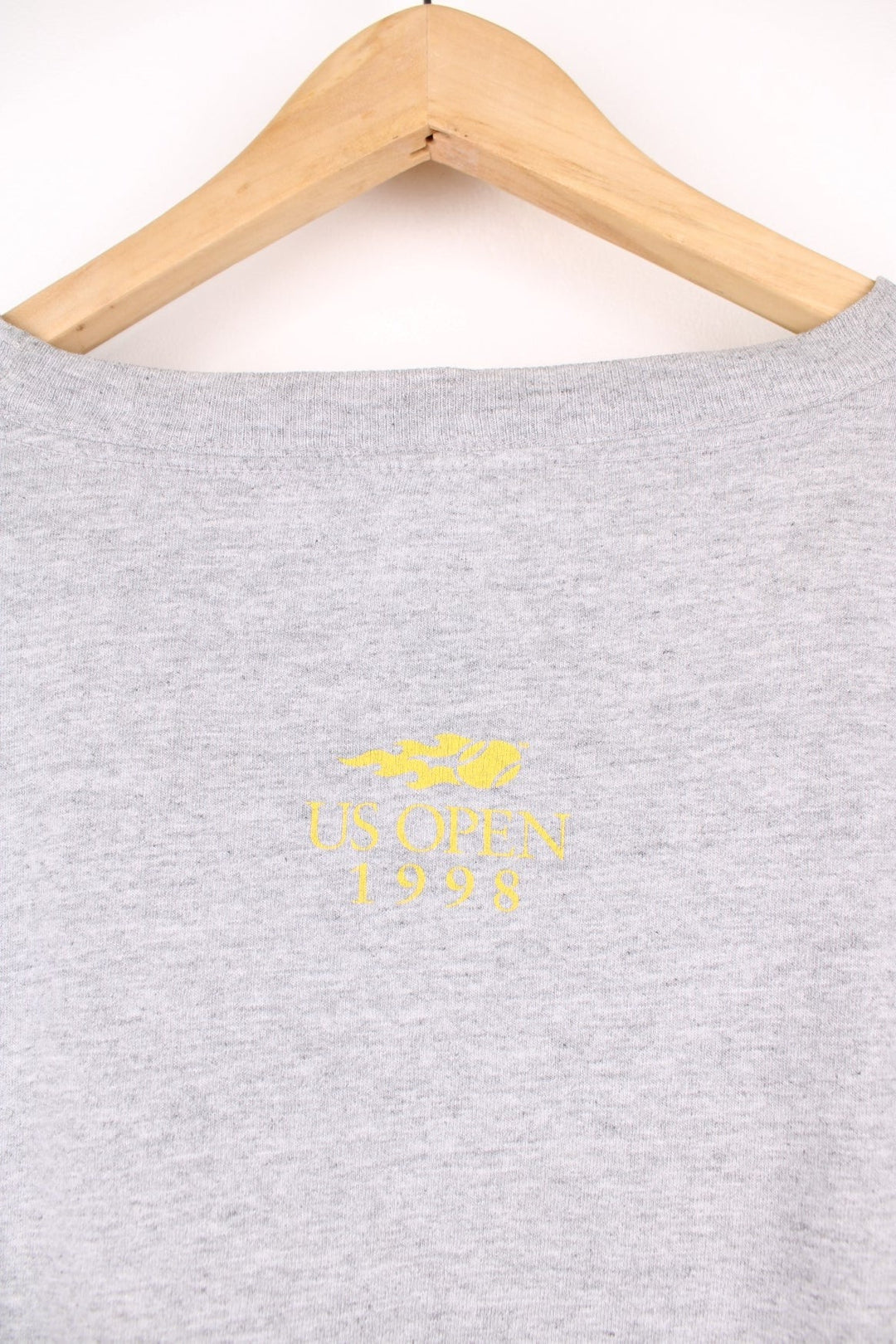 1998 US Open Starter T-Shirt in a grey colourway with the spell out logo printed across the front. 