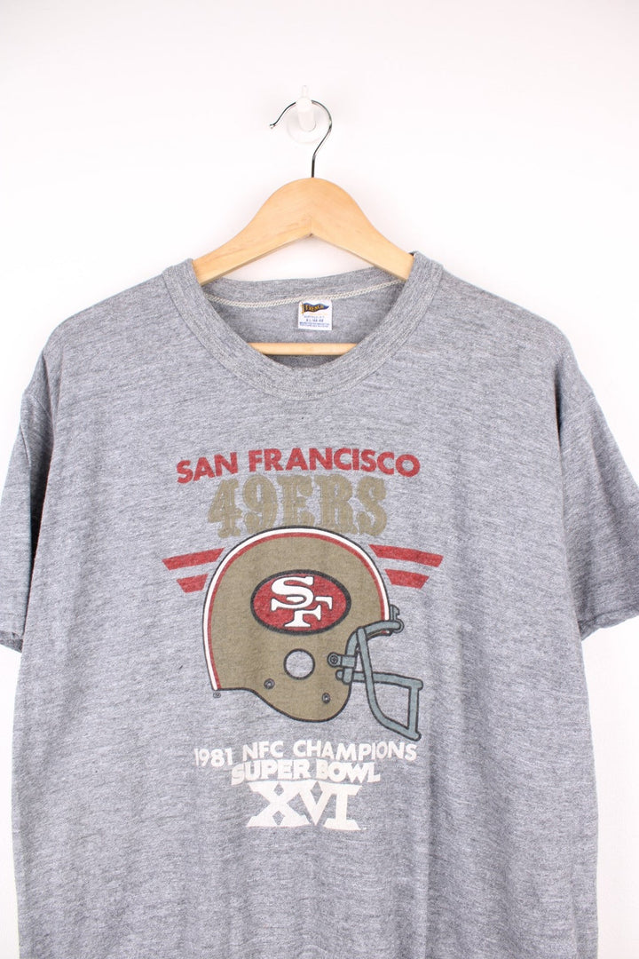 1981 San Francisco 49ers Super Bowl Champions T-Shirt in a grey colourway with the team logo and spell out printed on the front. 