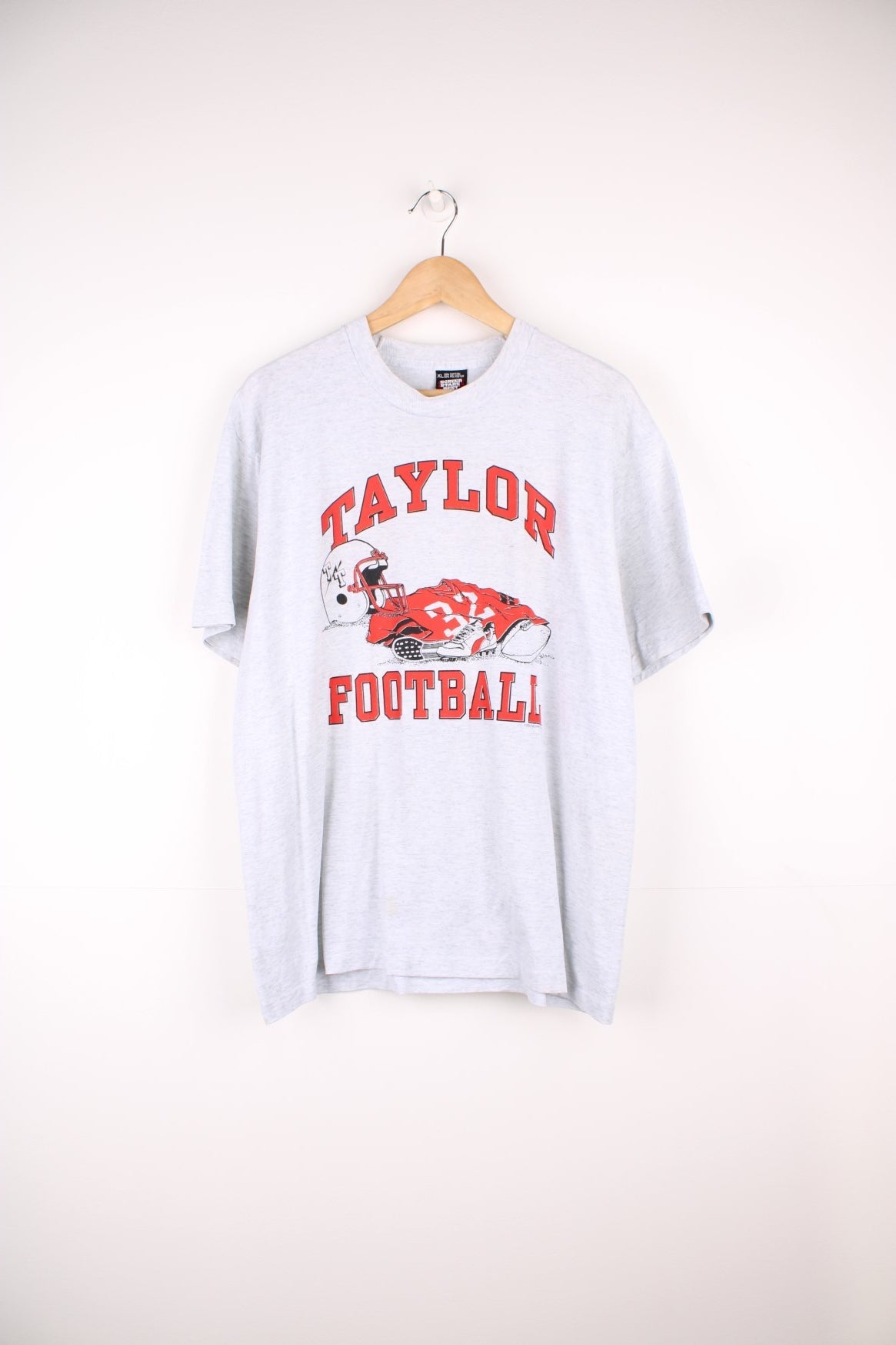 1992 Taylor Football T-Shirt with the spell out and graphic design printed on the front. 