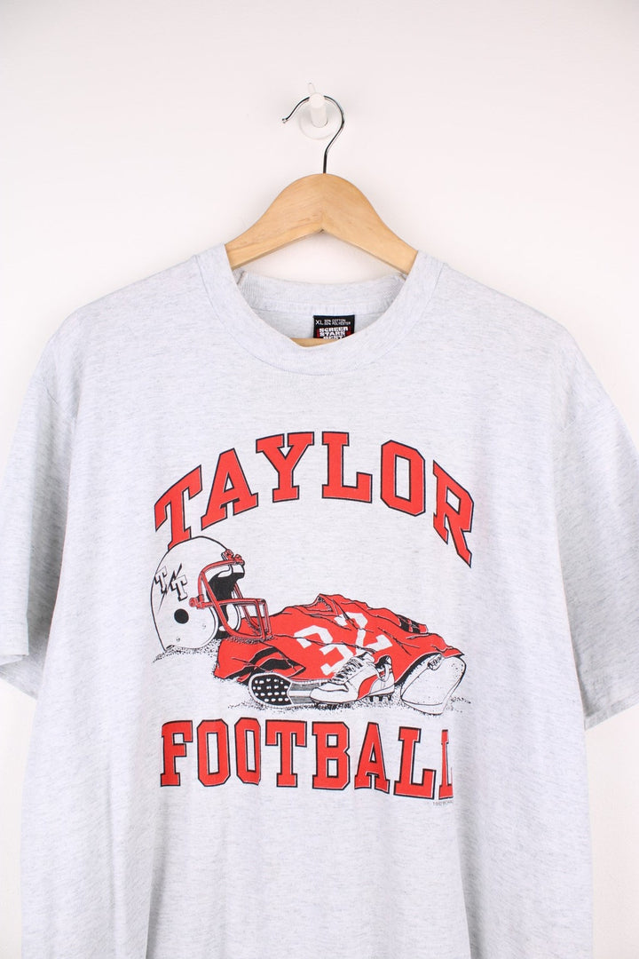 1992 Taylor Football T-Shirt with the spell out and graphic design printed on the front. 