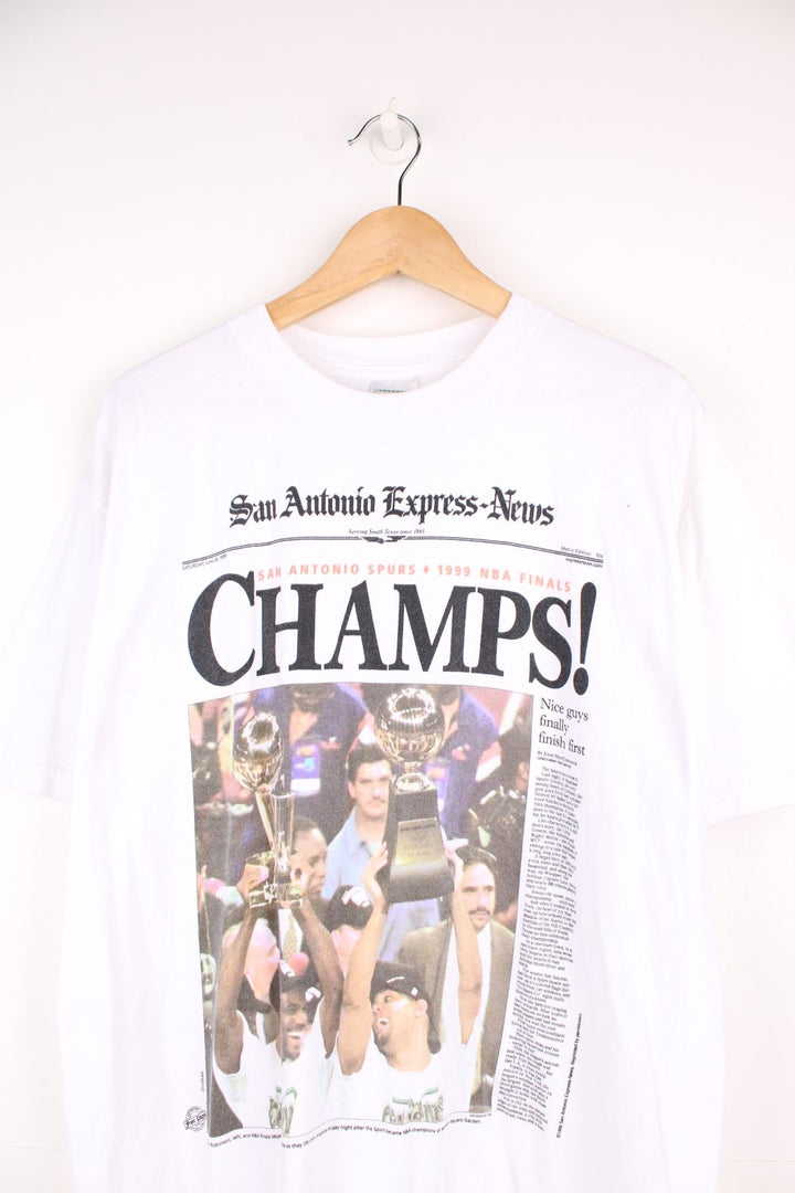 1999 San Antonio Spurs NBA Champions T-Shirt in a white colourway with a newspaper graphic design printed on the front.  