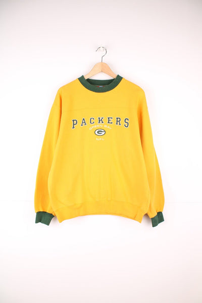 Green Bay Packers sweatshirt in yellow with embroidered logo across the chest.