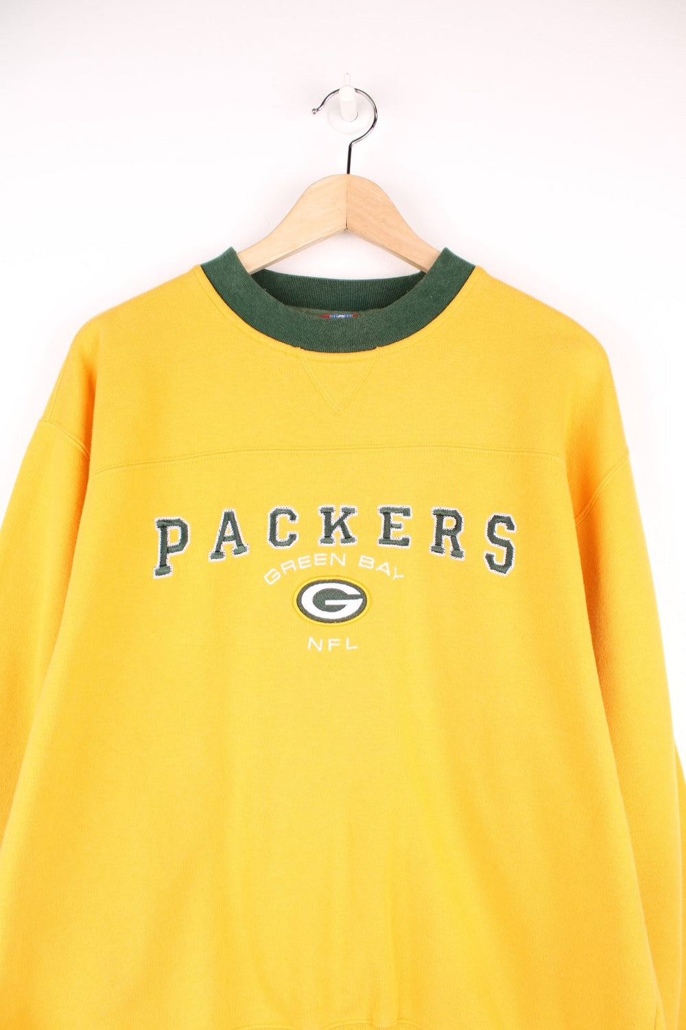 Green Bay Packers sweatshirt in yellow with embroidered logo across the chest.