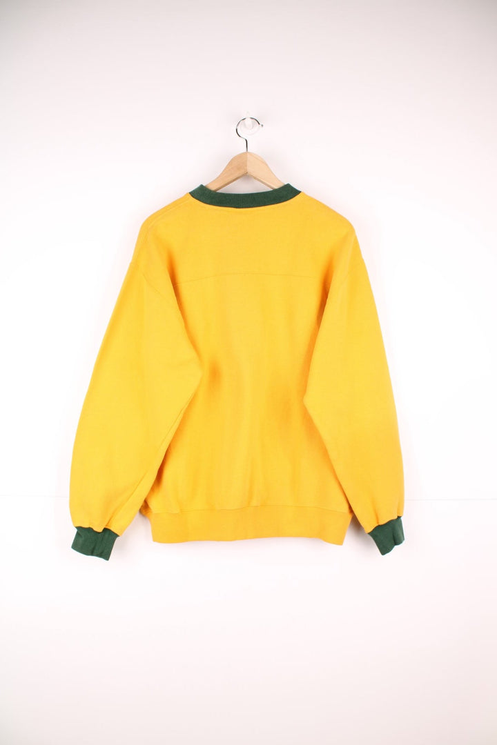 Green Bay Packers sweatshirt in yellow with embroidered logo across the chest.