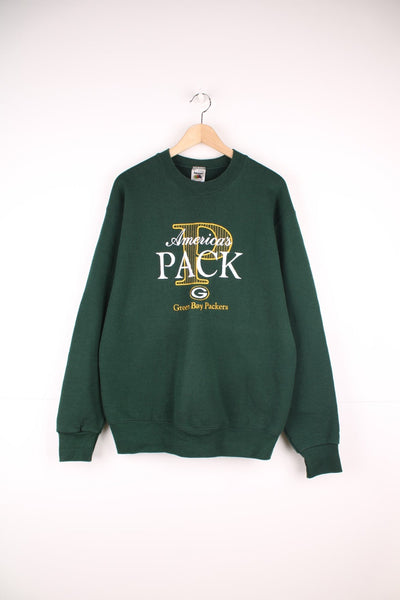 Green Bay Packers crew neck sweatshirt by Fruit of the Loom. Features embroidered logo across the chest.