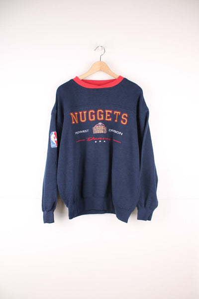 Vintage 90s Denver Nuggets sweatshirt with embroidered logo across the chest. 