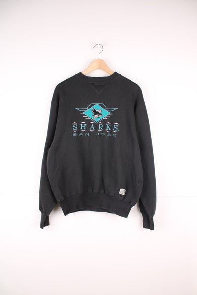 Vintage 90s San Jose Sharks sweatshirt with embroidered logo across the chest.