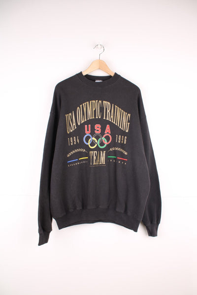 Vintage 1996 USA Olympic Training Team, Atlanta sweatshirt. Features large printed spell out logo on the front.