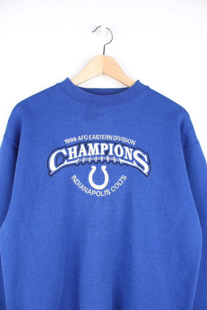 Vintage 1999 AFC Eastern Division Champions: Indianapolis Colts blue crewneck sweatshirt by Puma, features embroidered spell-out detail across the front