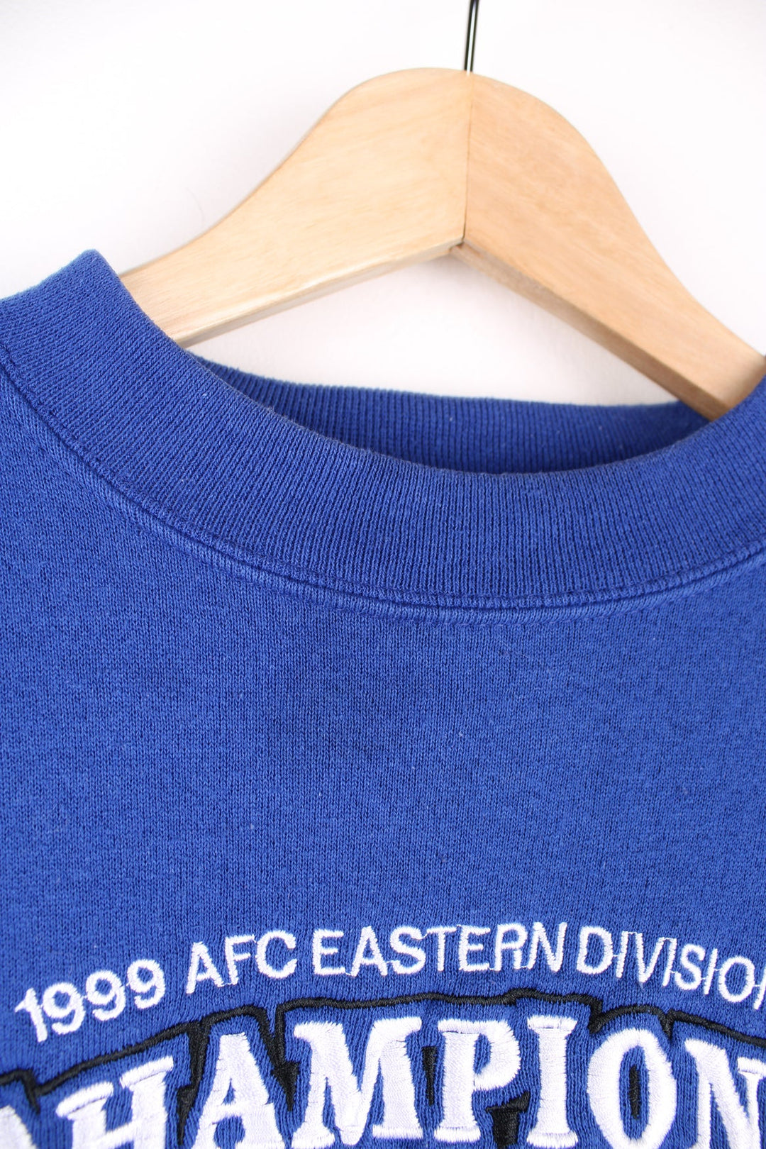 Vintage 1999 AFC Eastern Division Champions: Indianapolis Colts blue crewneck sweatshirt by Puma, features embroidered spell-out detail across the front