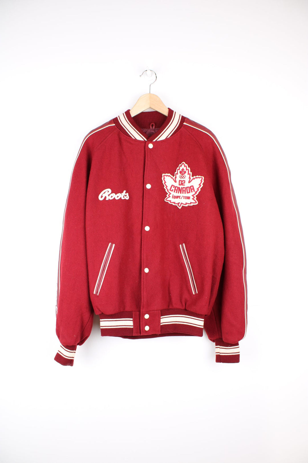 Vintage 2002 Winter Olympics team Canada varsity jacket, by Roots. Features embroidered badges and spell-out details