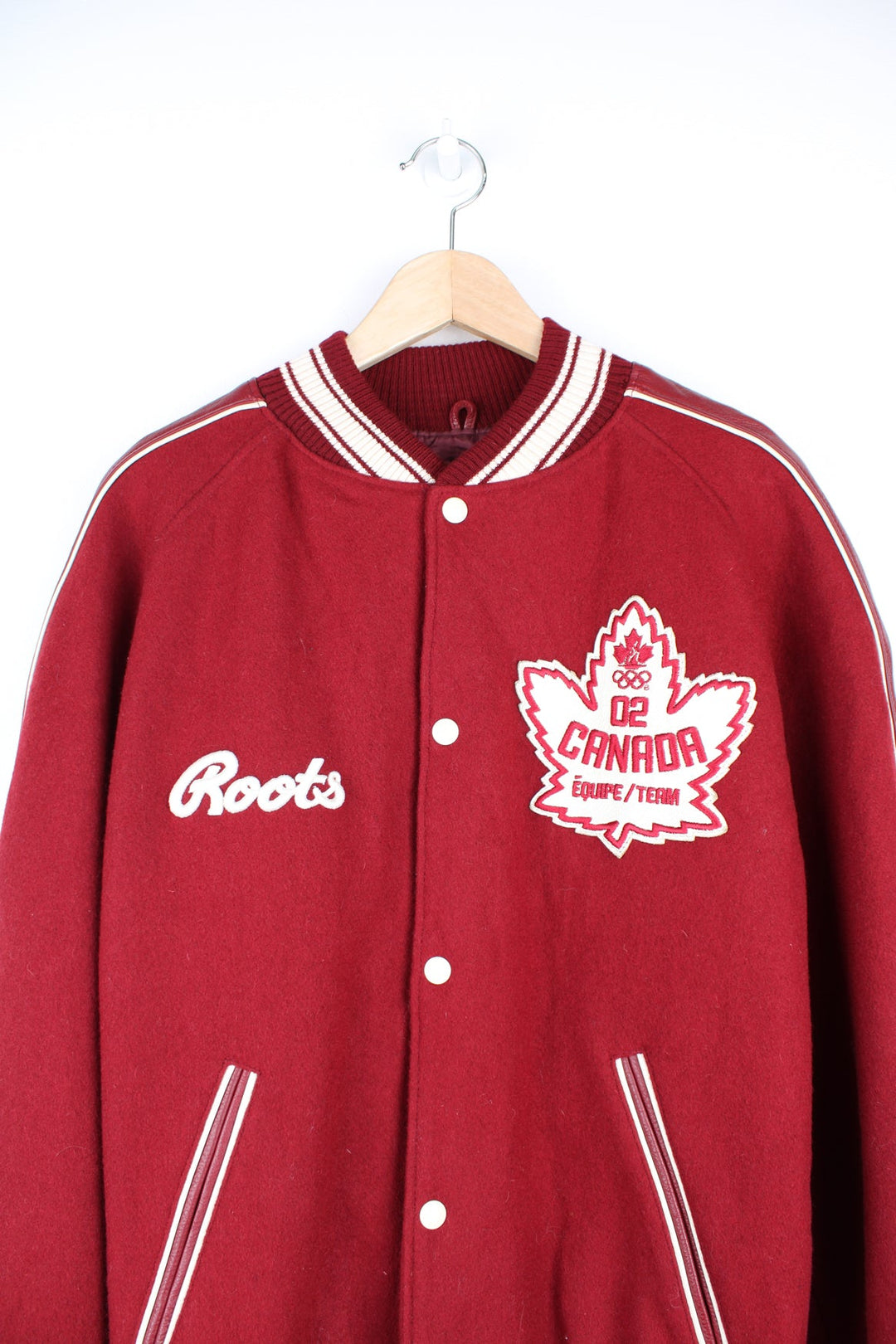 Vintage 2002 Winter Olympics team Canada varsity jacket, by Roots. Features embroidered badges and spell-out details