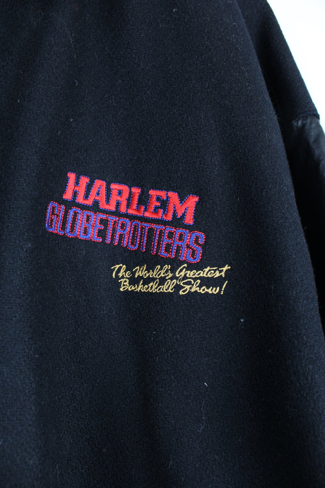 Vintage Harlem Globetrotters 'World Tour' varsity jacket by LP Designs, features embroidered name, badges and spell-out motif on the back