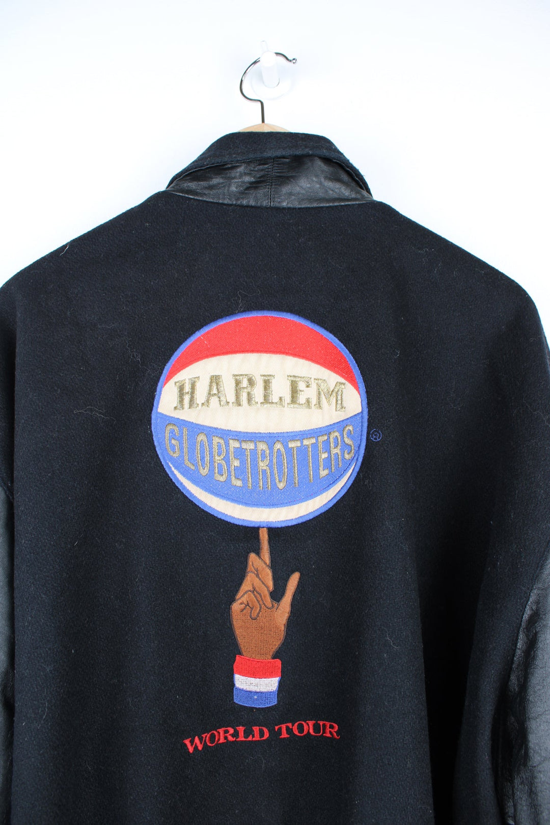 Vintage Harlem Globetrotters 'World Tour' varsity jacket by LP Designs, features embroidered name, badges and spell-out motif on the back