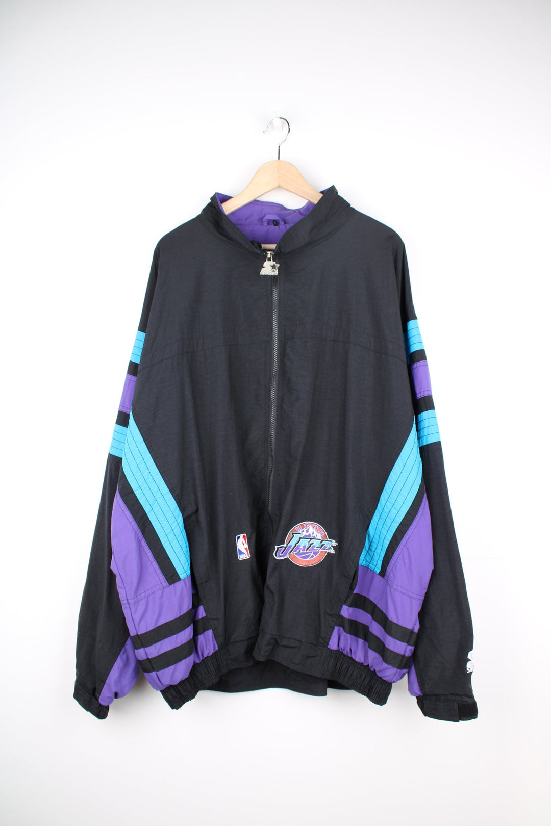 Vintage 1996 Utah Jazz NBA zip through track jacket in black and purple by Starter, features embroidered logos and badges